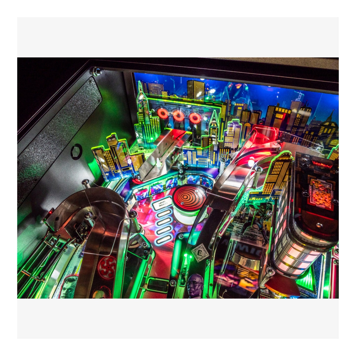 Colorful pinball machine with vibrant lights and detailed design.