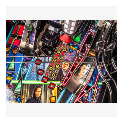 Close-up of a pinball machine with colorful mechanics and character images.