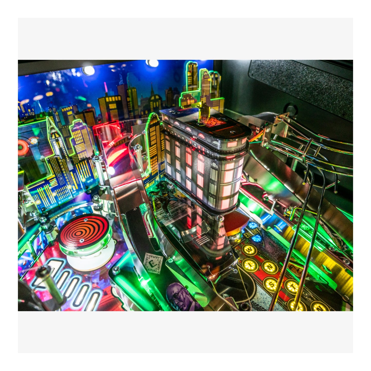 Colorful pinball machine with vibrant lights and detailed design.