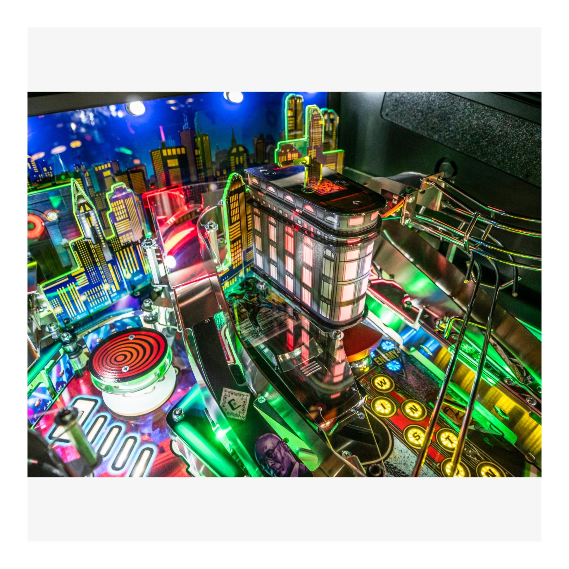 Colorful pinball machine with vibrant lights and detailed design.