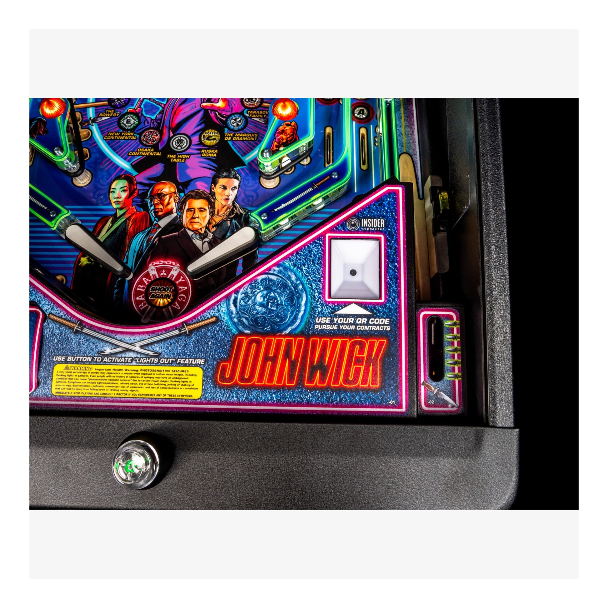 Pinball machine with 'John Wick' theme featuring characters and neon lights.