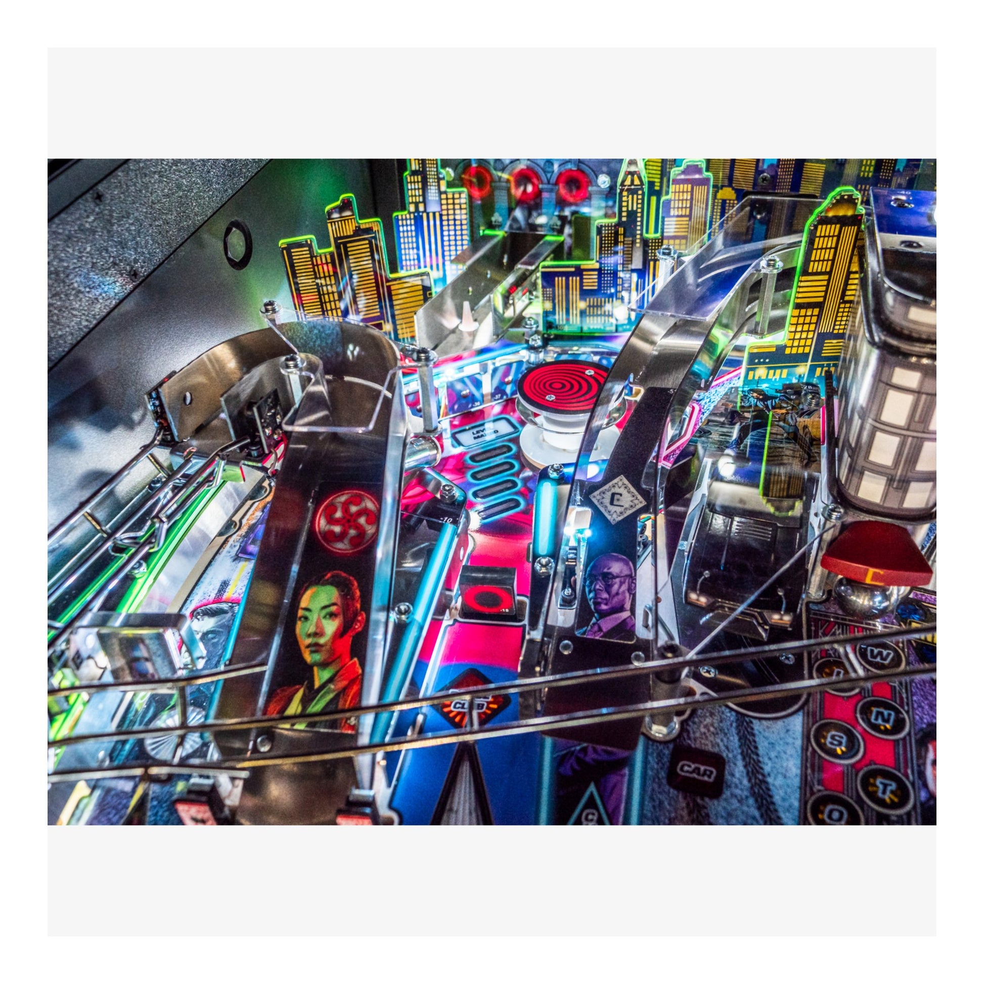 Close-up of a pinball machine with vibrant colors and detailed design.