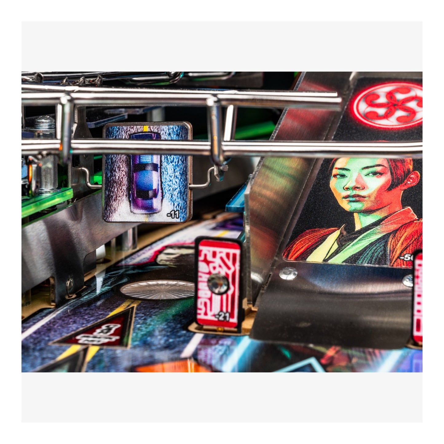 Close-up of a pinball machine with a character on the playfield