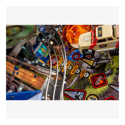 Close-up of a pinball machine with colorful artwork and mechanical components.