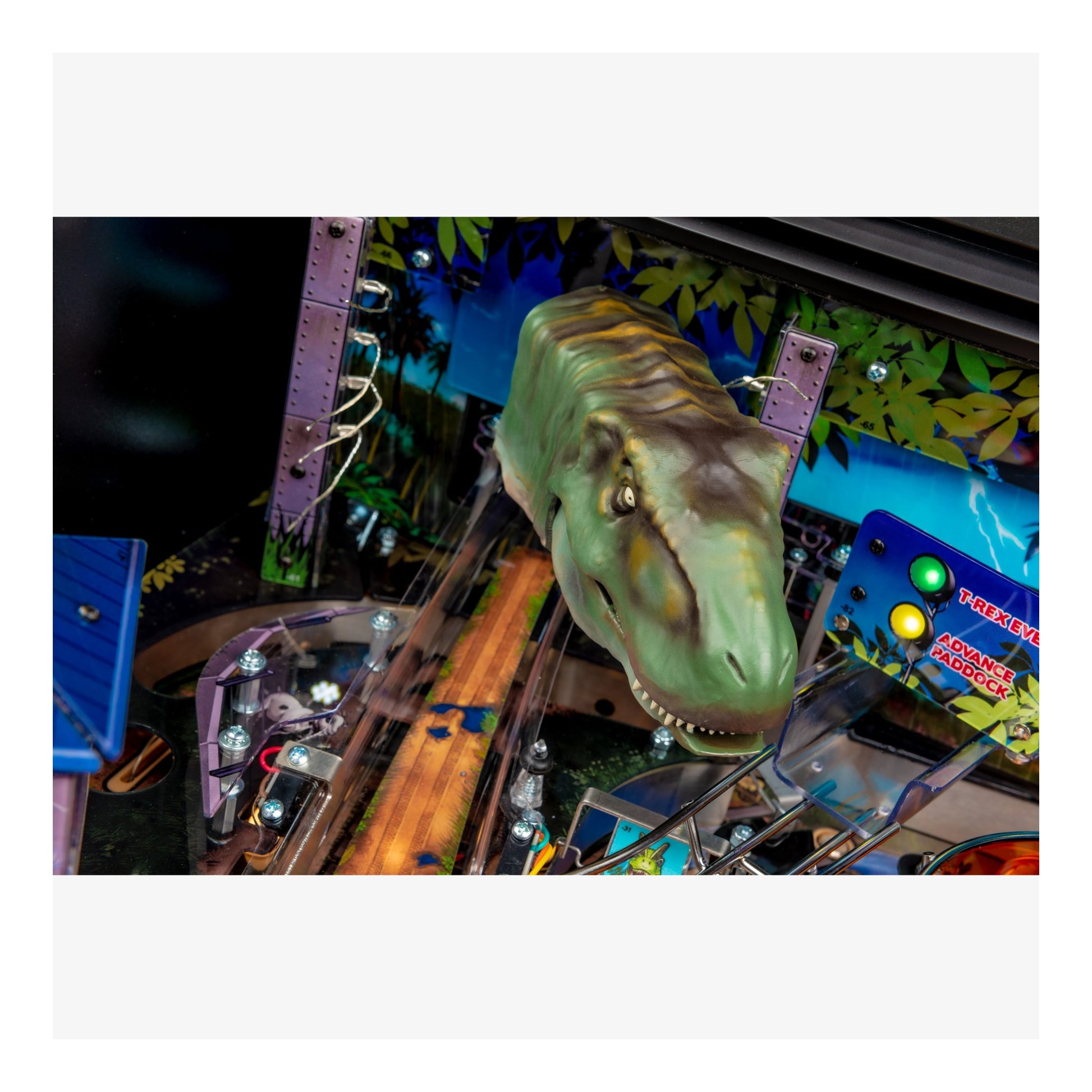 Dinosaur head figure on a pinball machine with colorful background