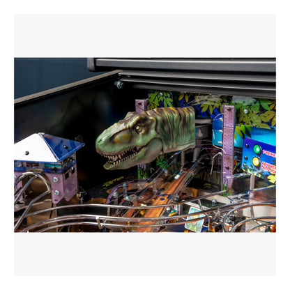 Pinball machine with a dinosaur figure in the playfield