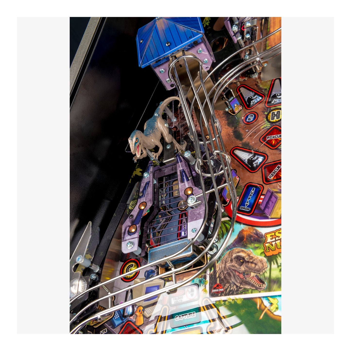 Close-up of a pinball machine with detailed artwork and elements.