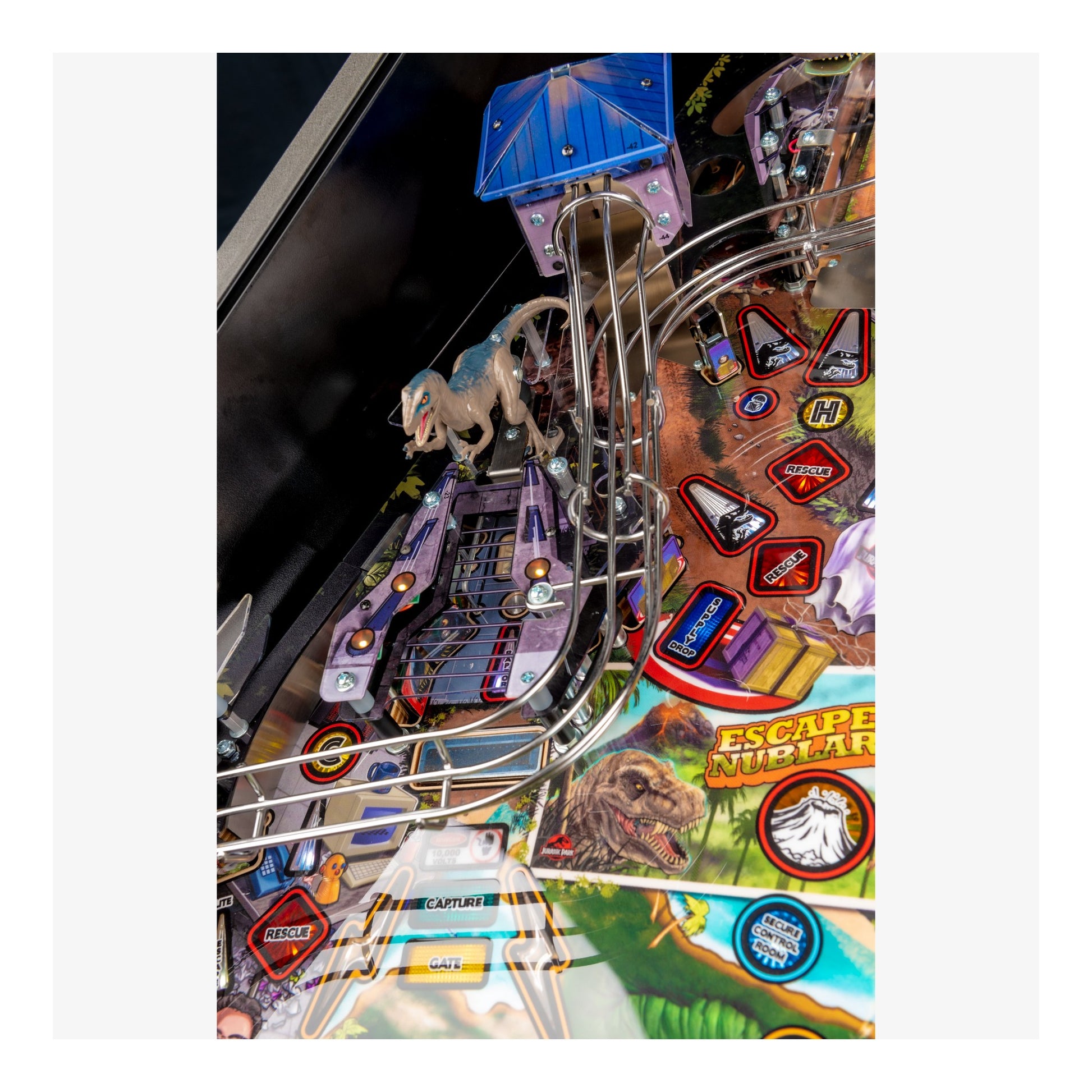 Close-up of a pinball machine with colorful artwork and game elements.