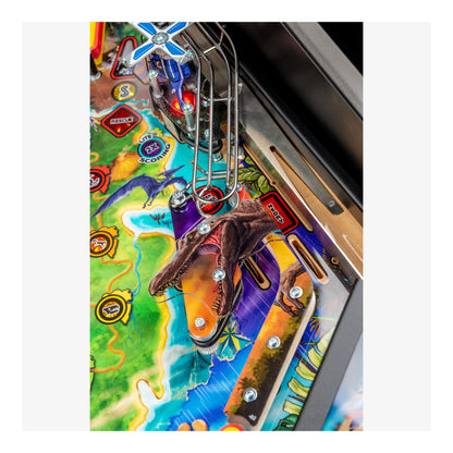 Close-up of a colorful pinball machine with a character on the playfield.