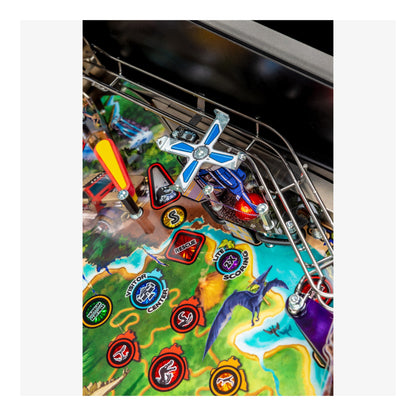 Close-up of a colorful pinball machine with various symbols and graphics.