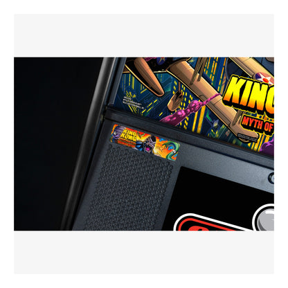 Close-up of a pinball machine with 'King Kong' artwork on the side.