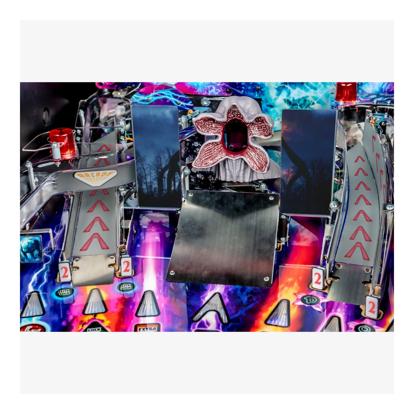 Close-up of a colorful pinball machine with vibrant lights and details.