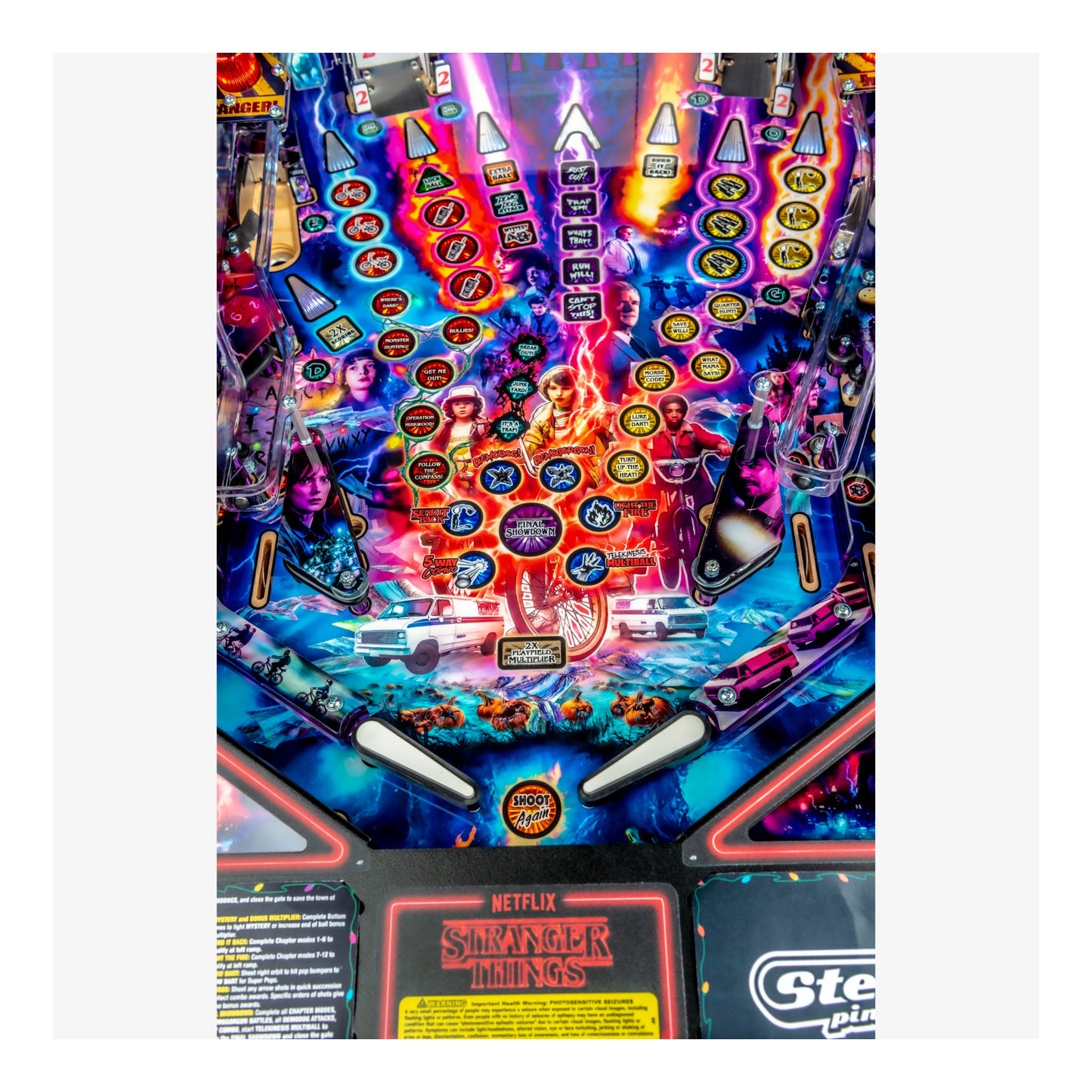 Pinball machine with 'Stranger Things' theme featuring colorful design and characters.