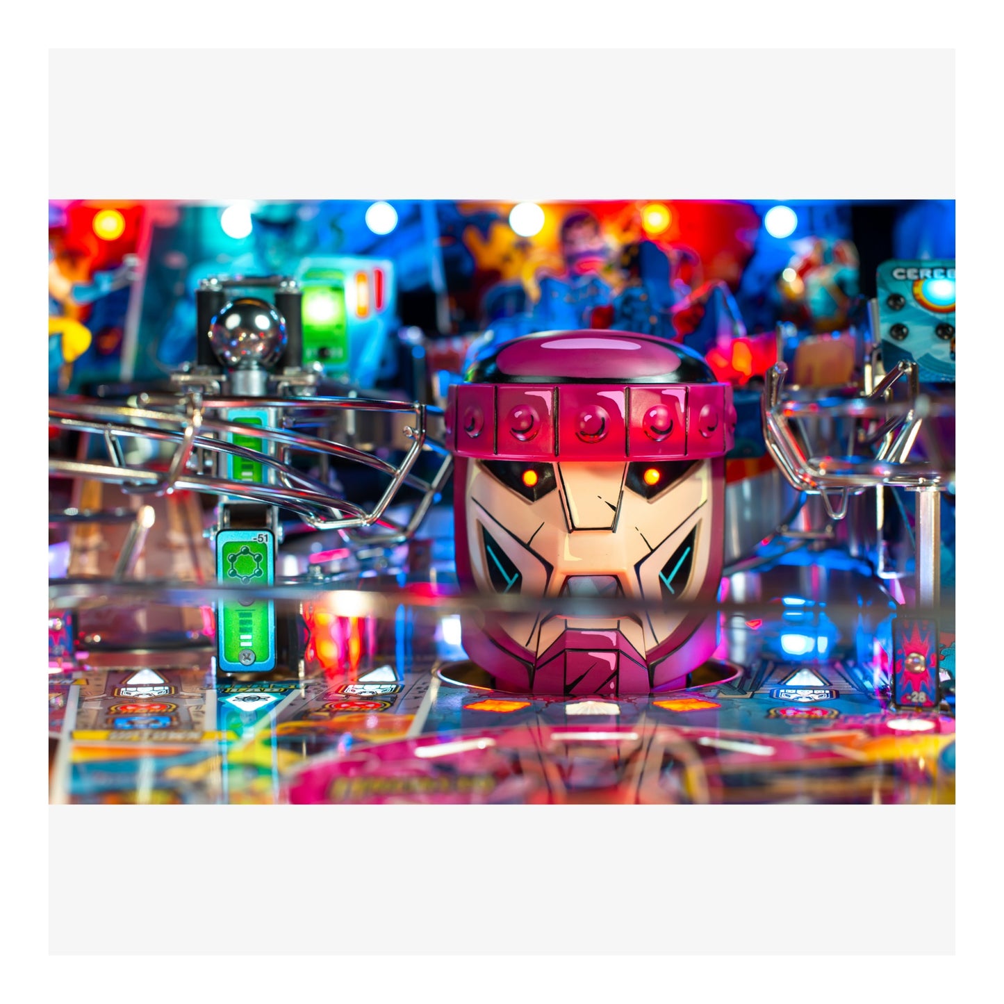 Colorful pinball machine with a robot figure on a reflective surface