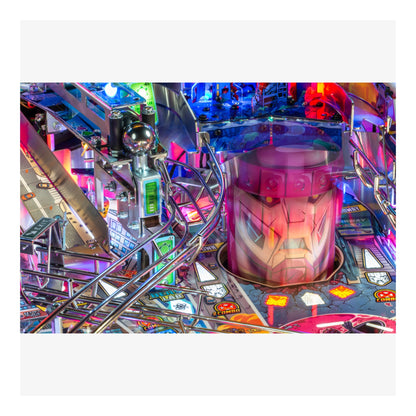 Close-up of a colorful pinball machine with vibrant lights and details.