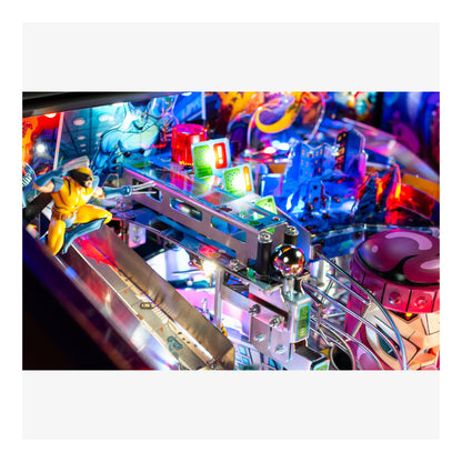 Close-up of a colorful pinball machine with vibrant lights and details.