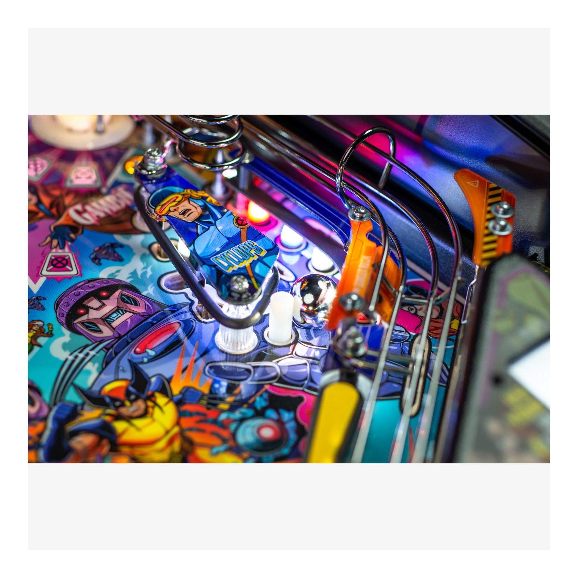 Close-up of a colorful pinball machine with vibrant artwork and mechanical components.