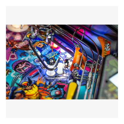 Close-up of a colorful pinball machine with vibrant artwork and mechanical components.