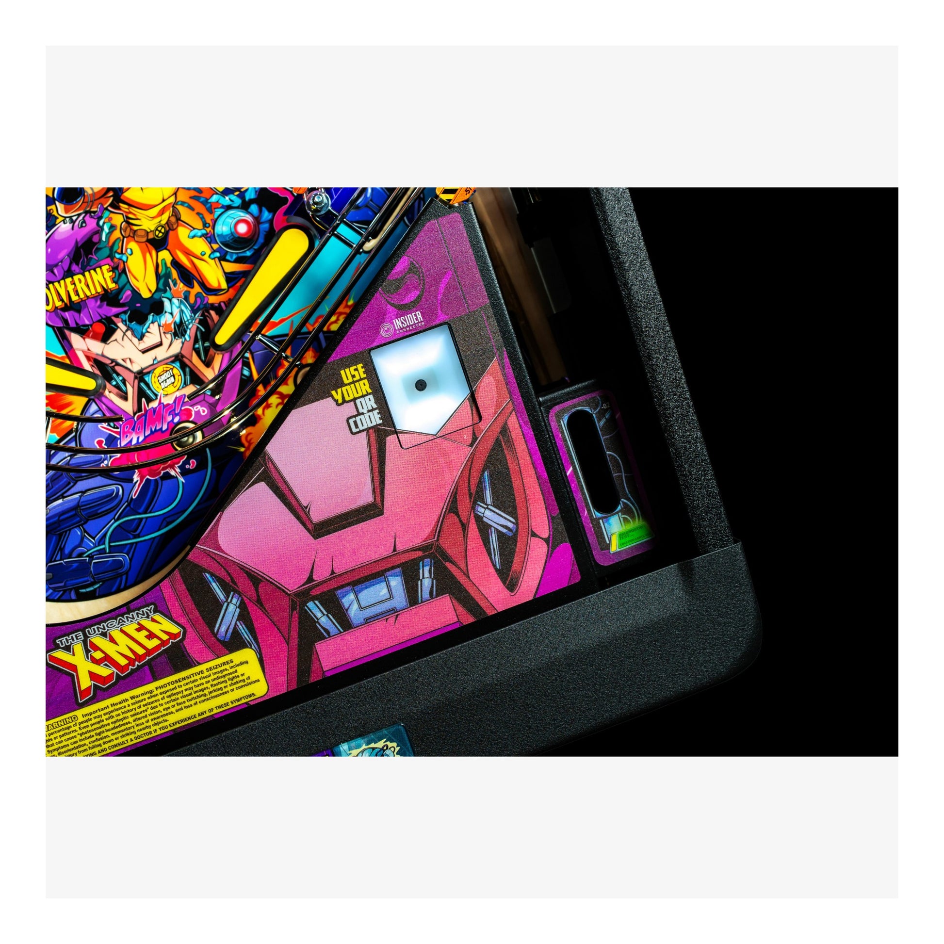 Close-up of a colorful pinball machine with vibrant graphics and text.