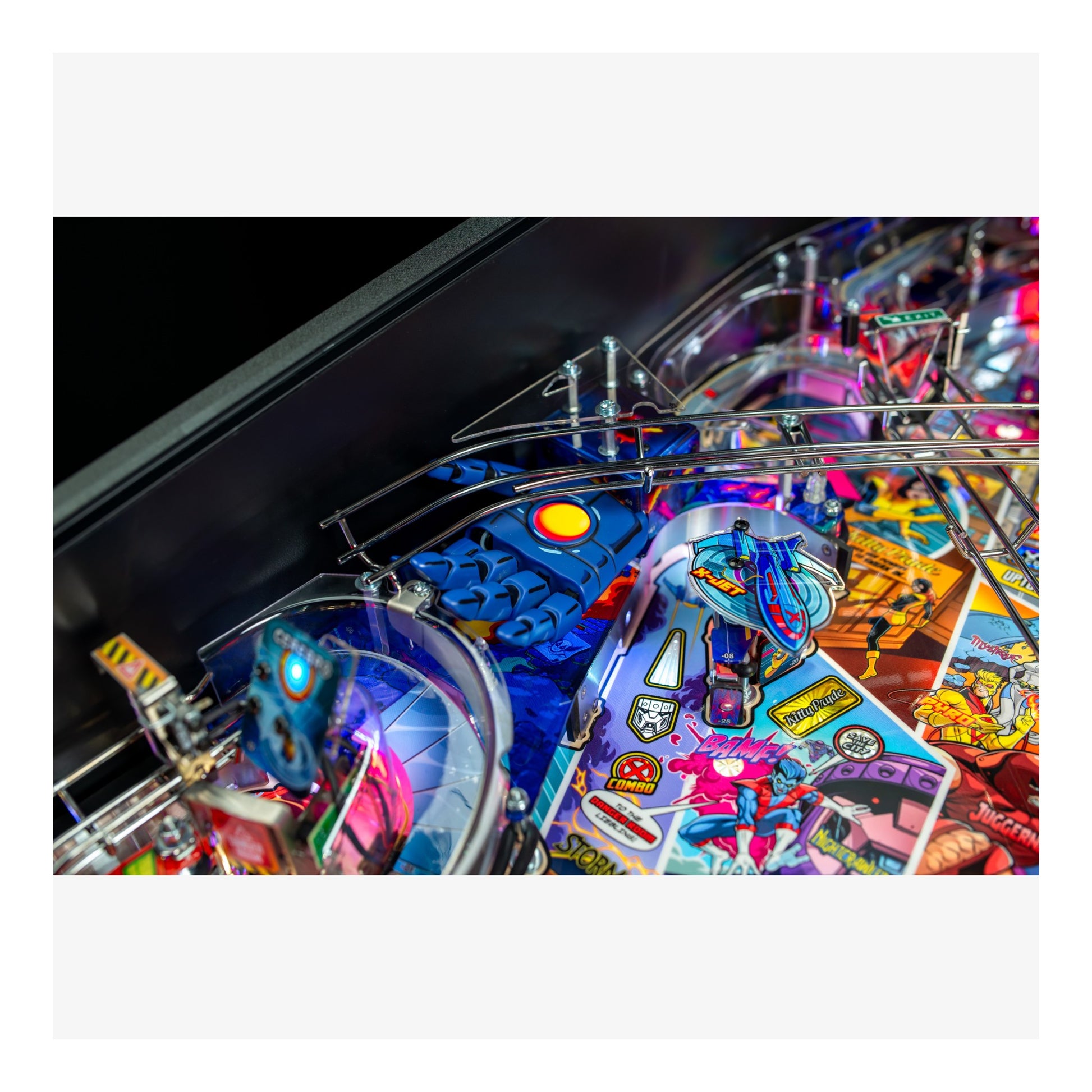 Close-up of a colorful pinball machine with various symbols and designs.