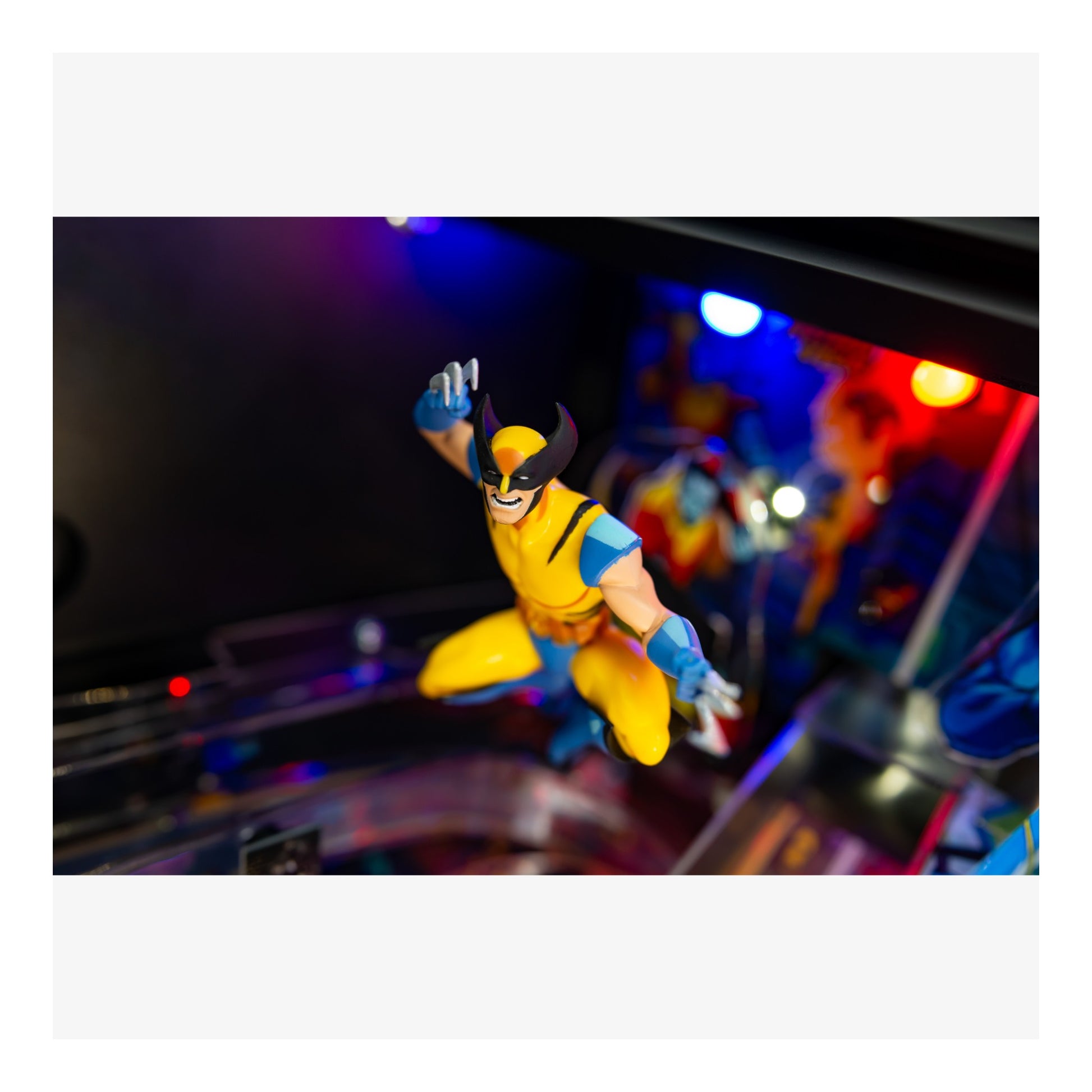 Superhero figure on a pinball machine with colorful lights in the background