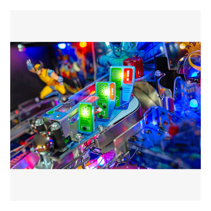 Close-up of a colorful pinball machine with lights and figures.