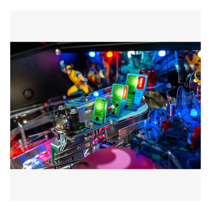 Close-up of a pinball machine with colorful lights and figures on a white background