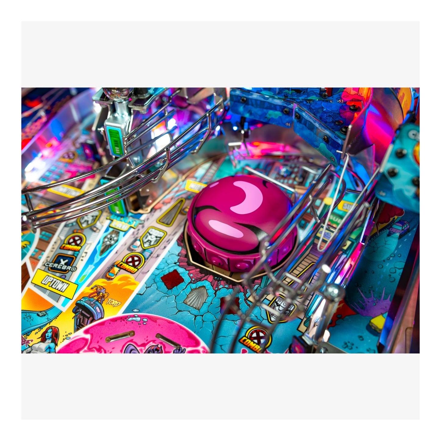 Close-up of a colorful pinball machine with vibrant lights and details.