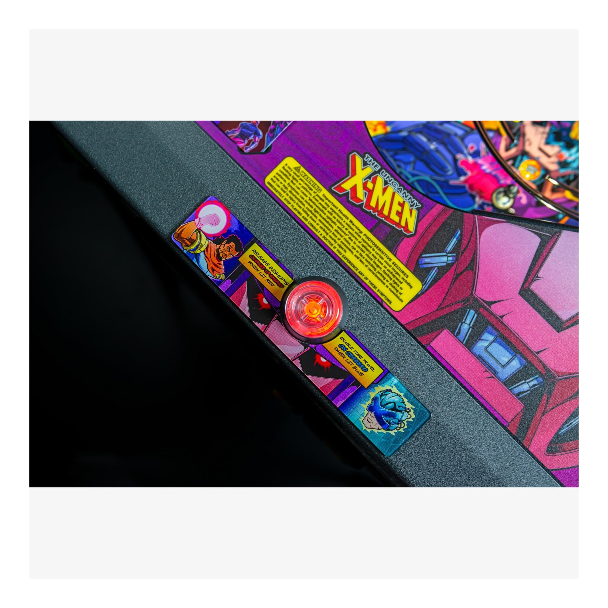 Close-up of a colorful pinball machine with 'X-Men' branding.