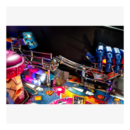 Close-up of a pinball machine with colorful playfield and mechanical components.