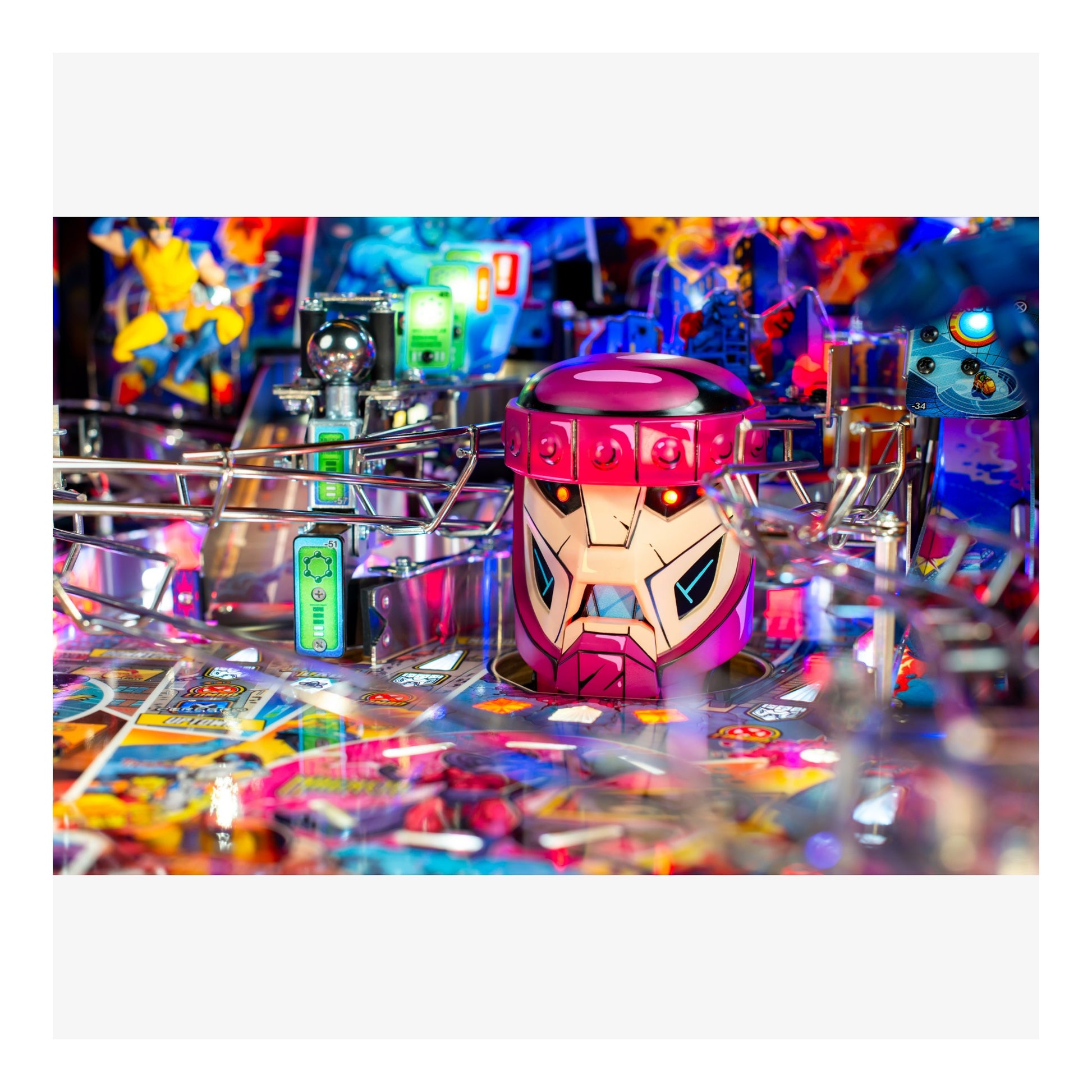 Colorful pinball machine with a robot figure on top