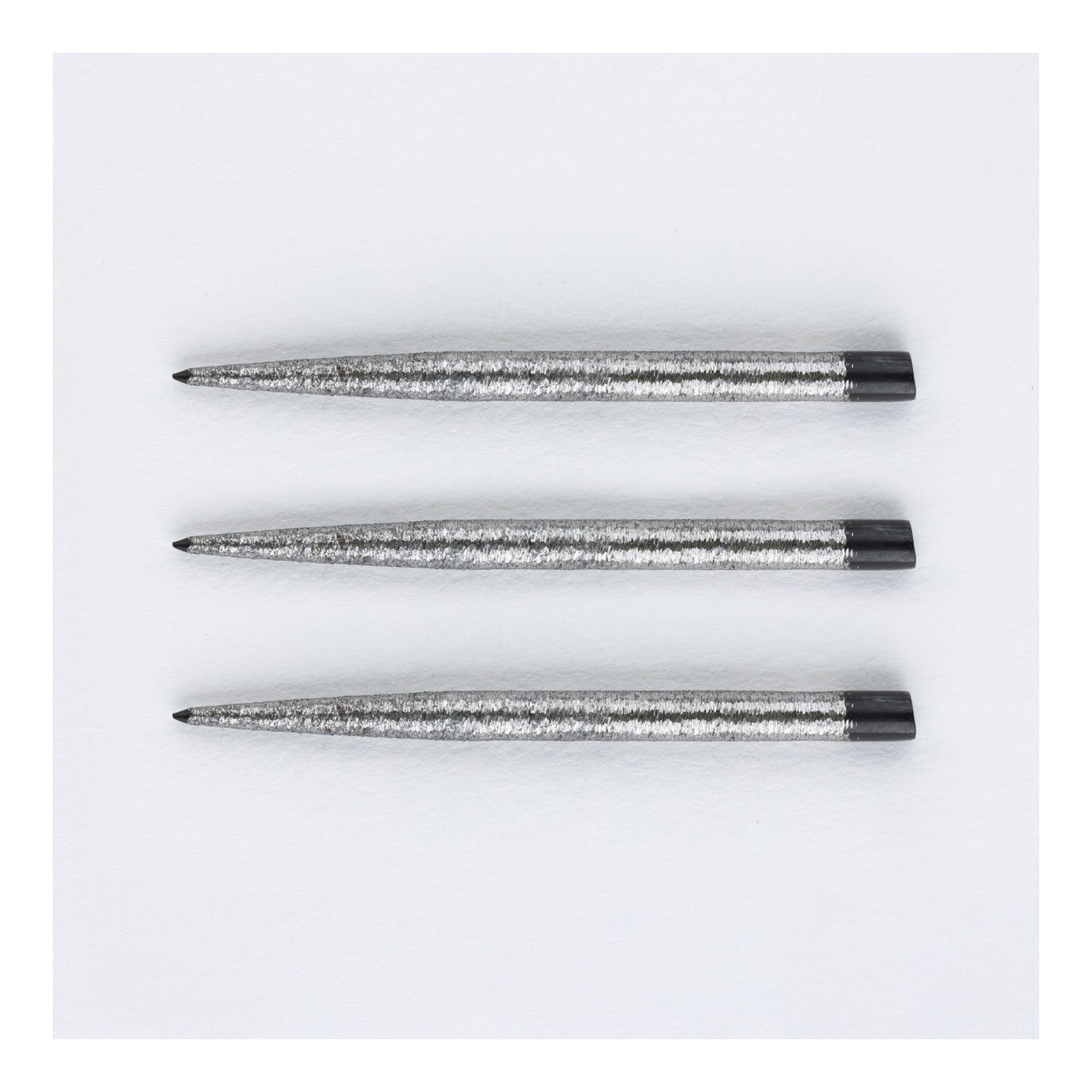Close-up of Punk Points Delinquent standard steel dart point showing continuous finish