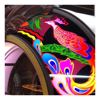 Colorful wheel with artistic design of a peacock