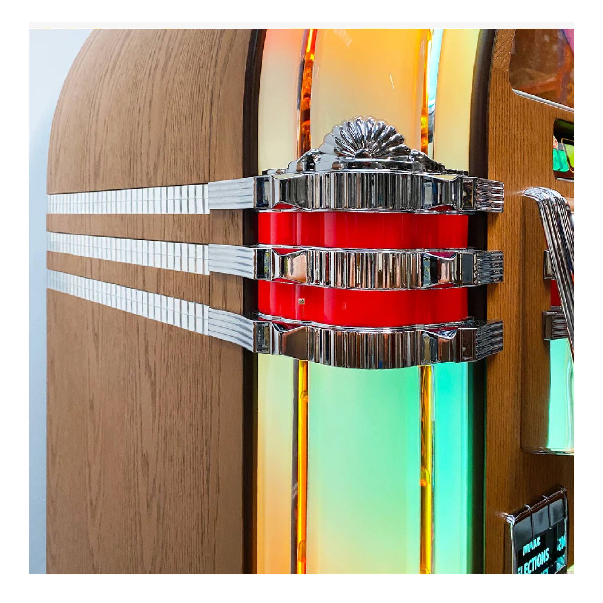 Close-up of a mechanical device with red central component and metallic arms on a colorful background.