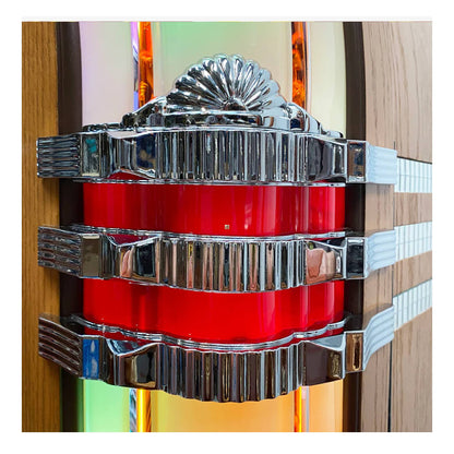 Decorative wall piece with red central component and silver metallic accents on a colorful background