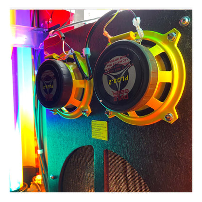 Colorful speaker system with visible branding on a multicolored background
