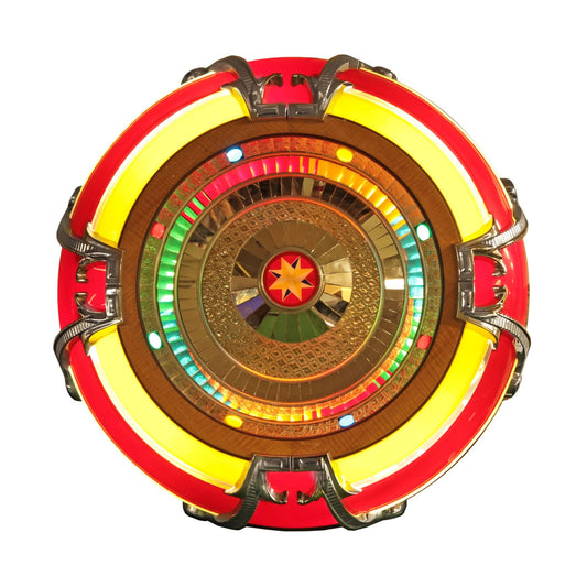 Decorative circular object with red, yellow, and gold colors on a white background