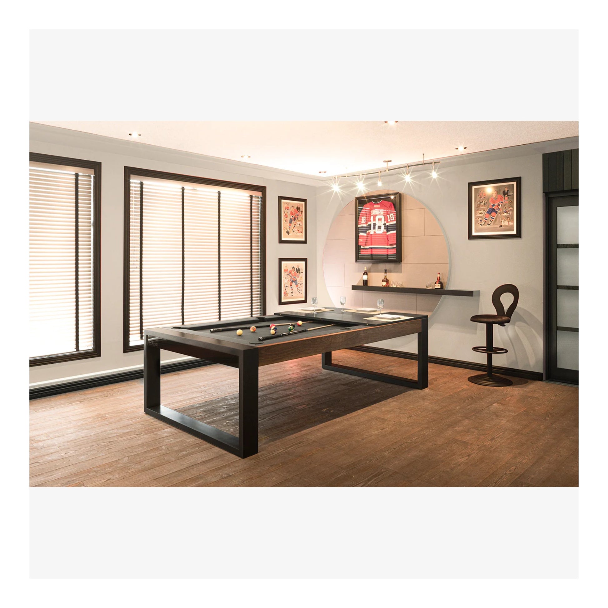 Pool table in a room with framed pictures on the wall