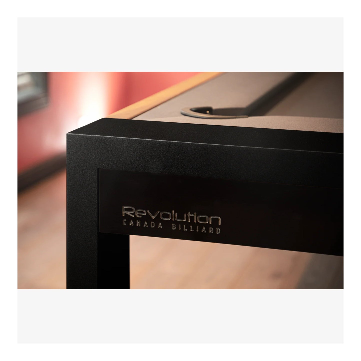 Close-up of a pool table with 'Revolution Canada Billiards' branding.