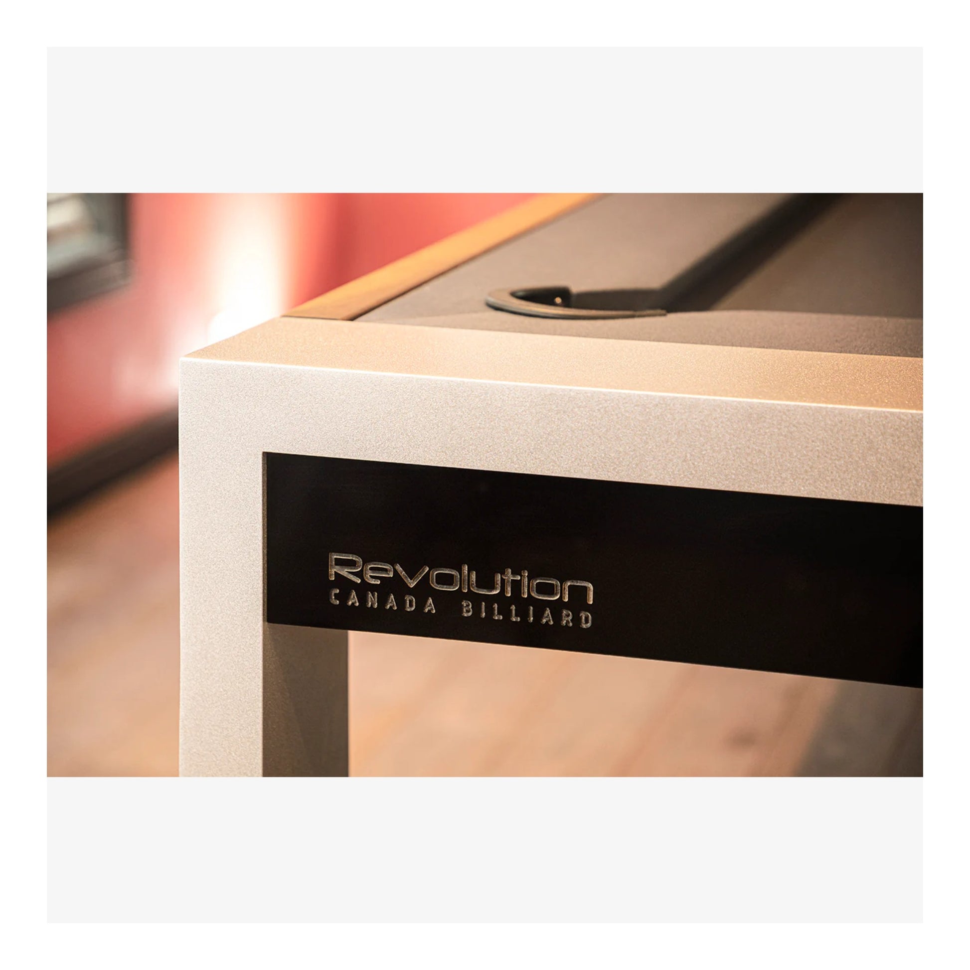 Close-up of a pool table with 'Revolution Canada Billiard' branding.