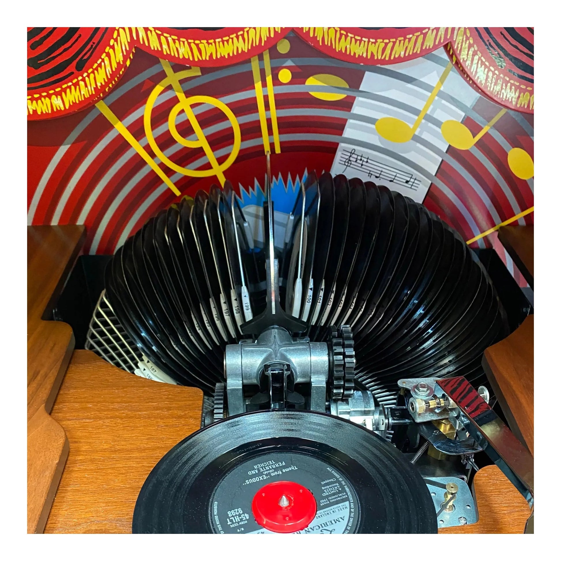 Vintage record player with a colorful vinyl record on a wooden surface