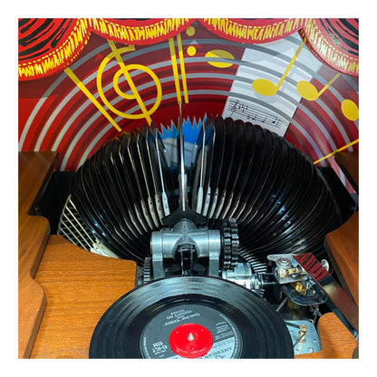 Vintage record player with a colorful vinyl record on a wooden surface