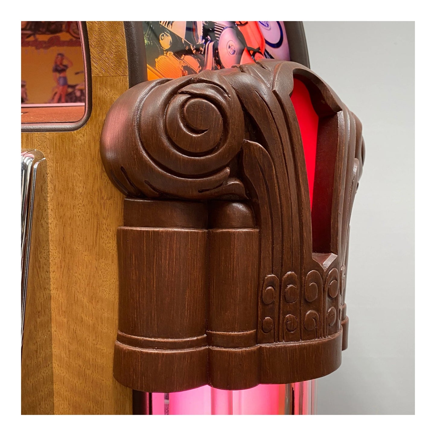 Decorative wooden column with intricate carvings against a colorful background