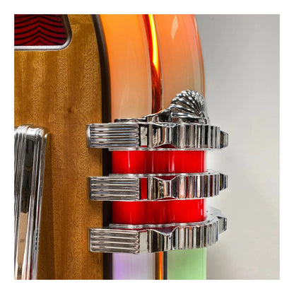 Close-up of a guitar with a red and silver pickguard on a white background