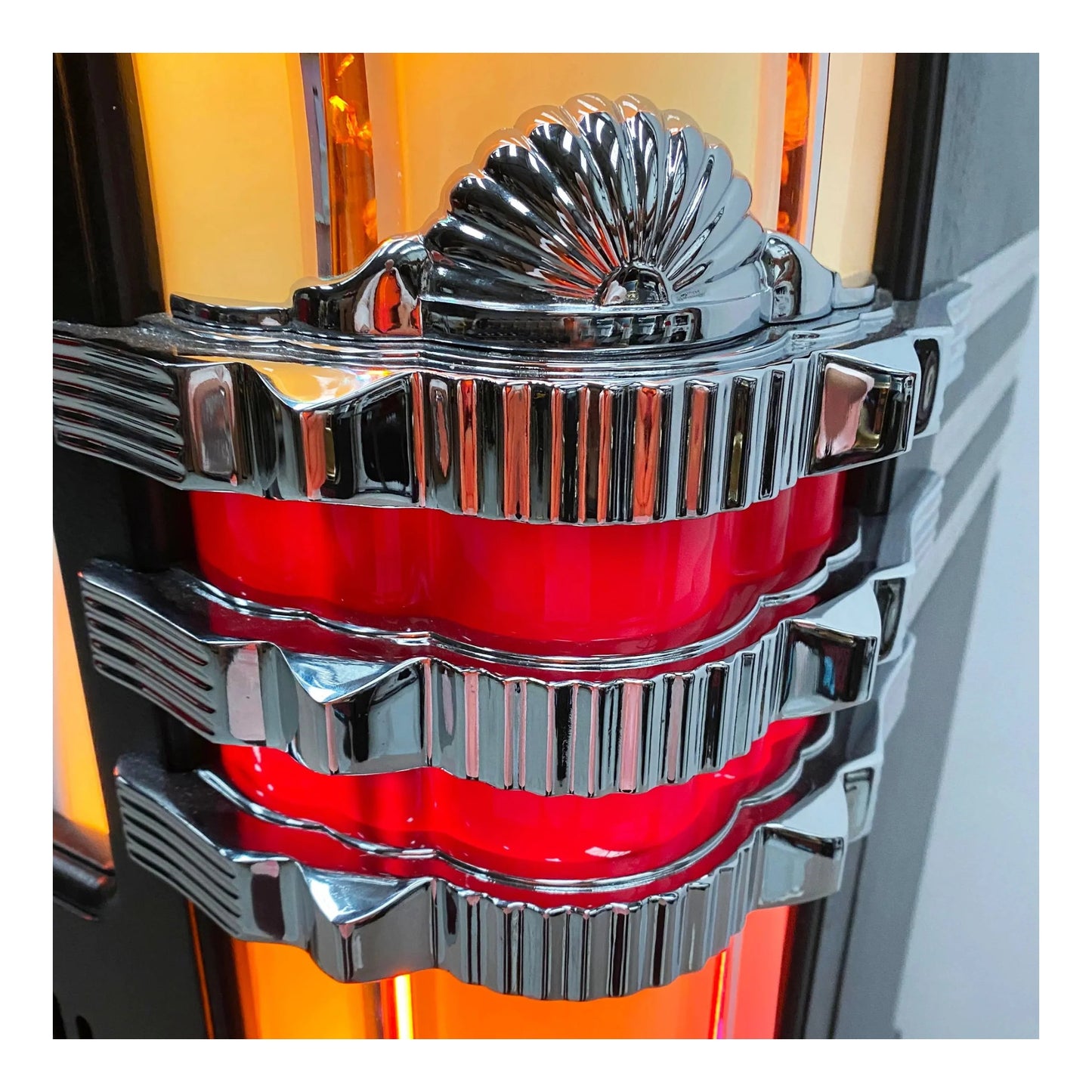 Close-up of a shiny metallic and red mechanical component