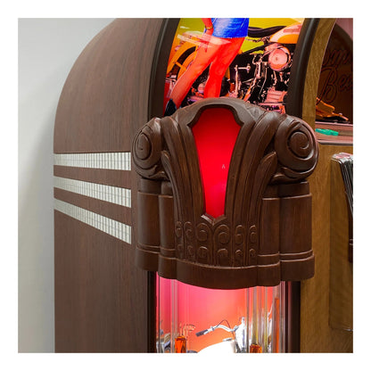 Close-up of a vintage-style jukebox with a red interior light.