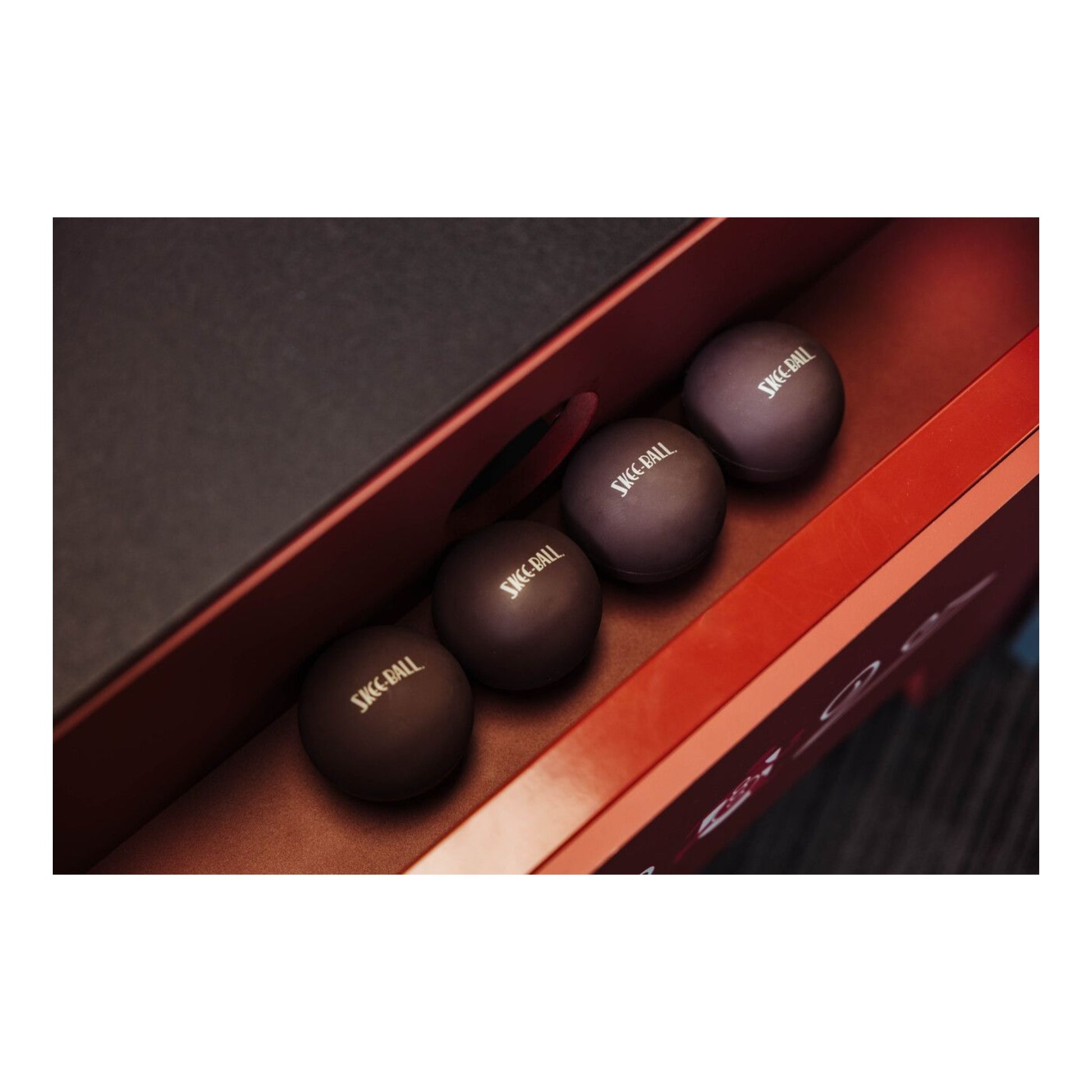 Set of four authentic Skee-Ball branded rubber game balls