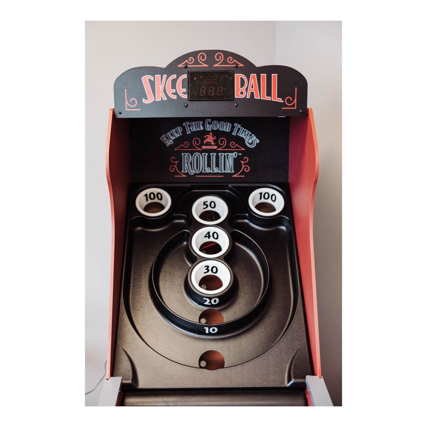 Detail of the durable plastic playfield on the Skee-Ball Home Arcade Deluxe