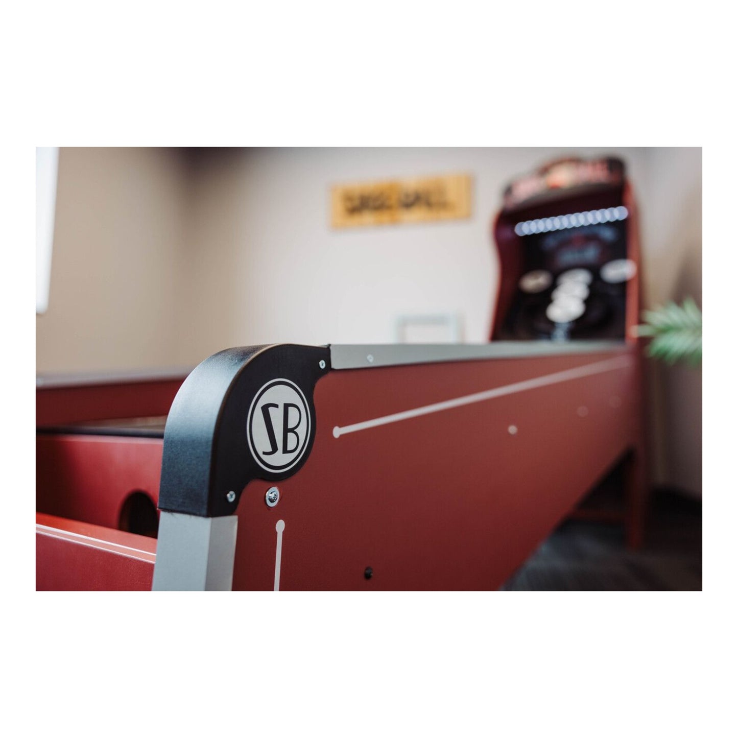 Angled side profile of the rich burgundy Skee-Ball Home Arcade machine