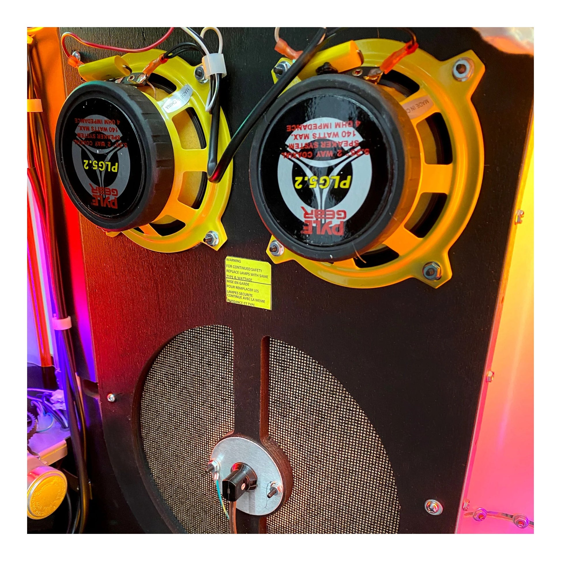 Speaker with visible brand name and model number on a colorful background